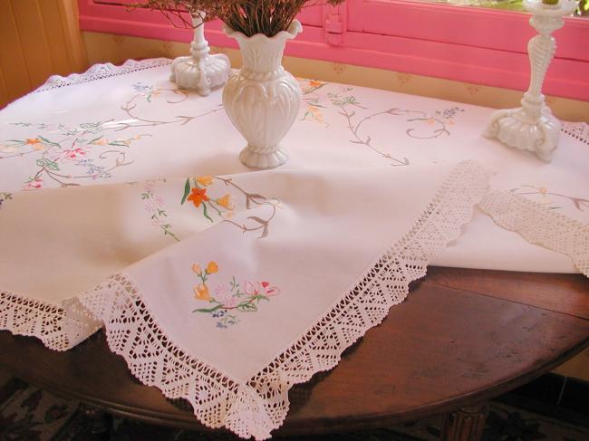 Really breathtaking tablecloth with hand-embroidered flowers and lace edging