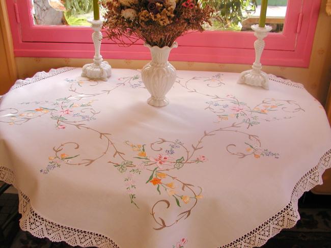 Really breathtaking tablecloth with hand-embroidered flowers and lace edging