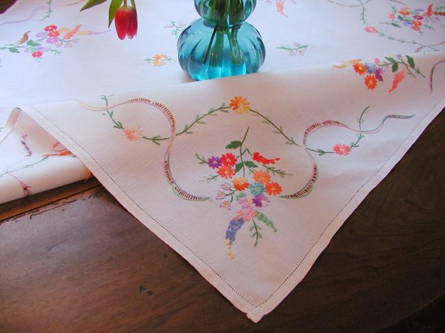 Really adorable tablecloth with hand-embroidered wild bouquets and ribbons