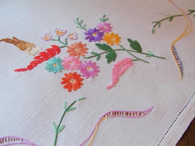 Really adorable tablecloth with hand-embroidered wild bouquets and ribbons