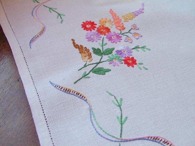 Really adorable tablecloth with hand-embroidered wild bouquets and ribbons