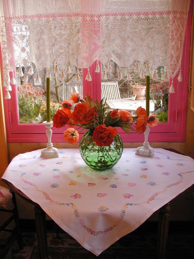 Really adorable tablecloth with hand-embroidered tiny bouquets and garland