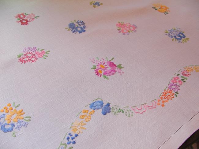 Really adorable tablecloth with hand-embroidered tiny bouquets and garland