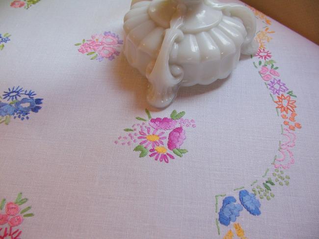 Really adorable tablecloth with hand-embroidered tiny bouquets and garland