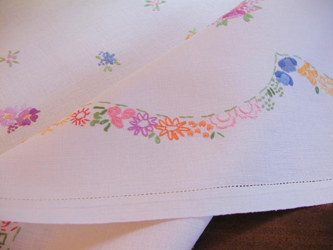 Really adorable tablecloth with hand-embroidered tiny bouquets and garland