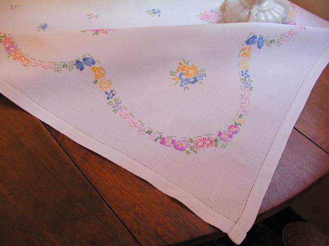 Really adorable tablecloth with hand-embroidered tiny bouquets and garland