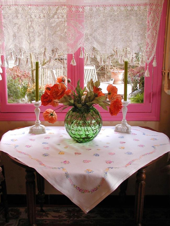 Really adorable tablecloth with hand-embroidered tiny bouquets and garland