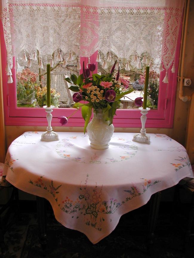 Lovely tablecloth with hand-embroidered flowers in crown and long bellflower