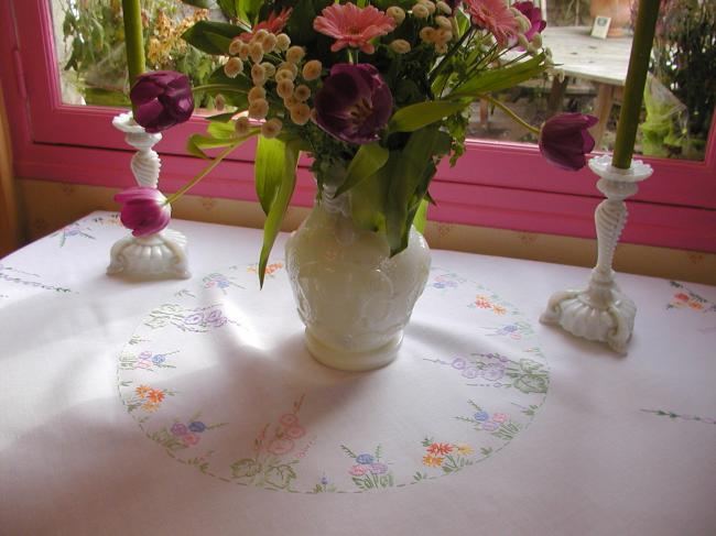 Lovely tablecloth with hand-embroidered flowers in crown and long bellflower