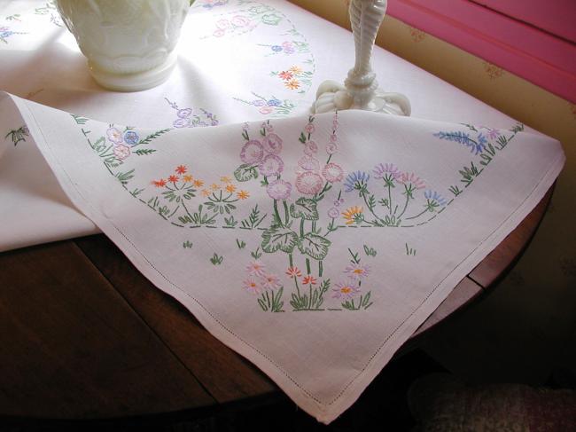 Lovely tablecloth with hand-embroidered flowers in crown and long bellflower