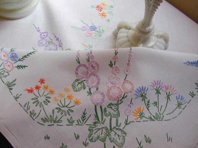 Lovely tablecloth with hand-embroidered flowers in crown and long bellflower