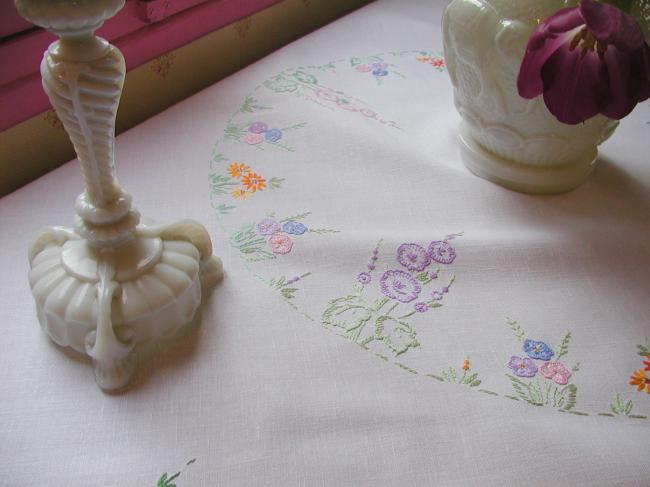 Lovely tablecloth with hand-embroidered flowers in crown and long bellflower