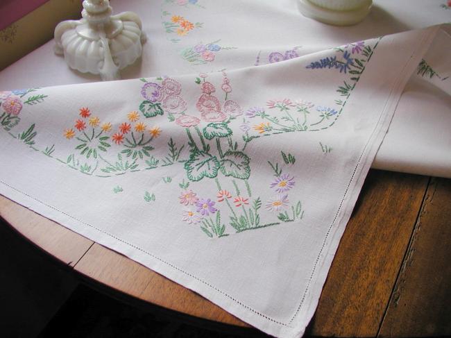 Lovely tablecloth with hand-embroidered flowers in crown and long bellflower