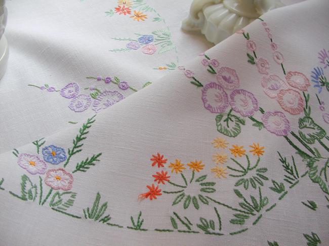 Lovely tablecloth with hand-embroidered flowers in crown and long bellflower