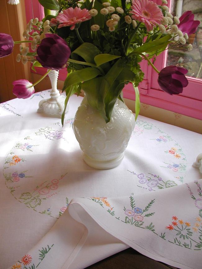 Lovely tablecloth with hand-embroidered flowers in crown and long bellflower