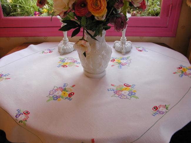 Really adorable tablecloth with hand-embroidered Spring bouquet