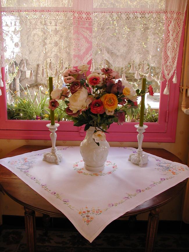 Lovely tablecloth with hand-embroidered flowers in crown and long bell-flower