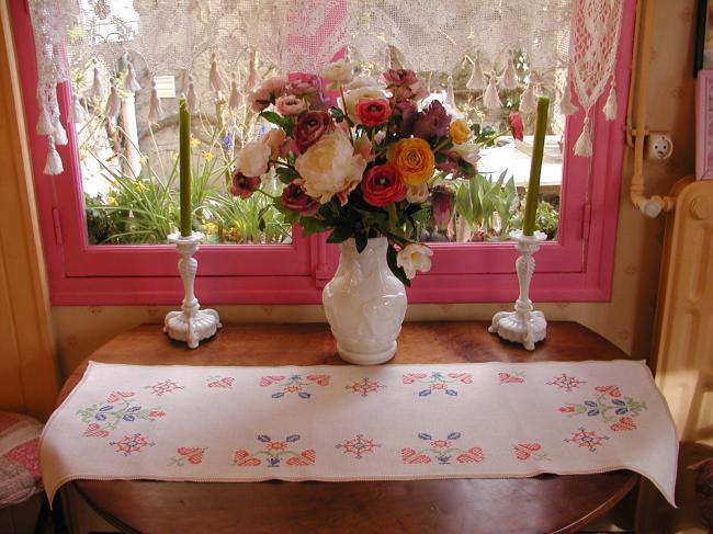 Very pretty table runner with hand-emboidery made in cross stitches