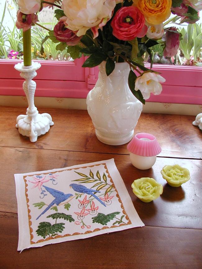 Lovely linen doily with hand-embroidered exotic birds