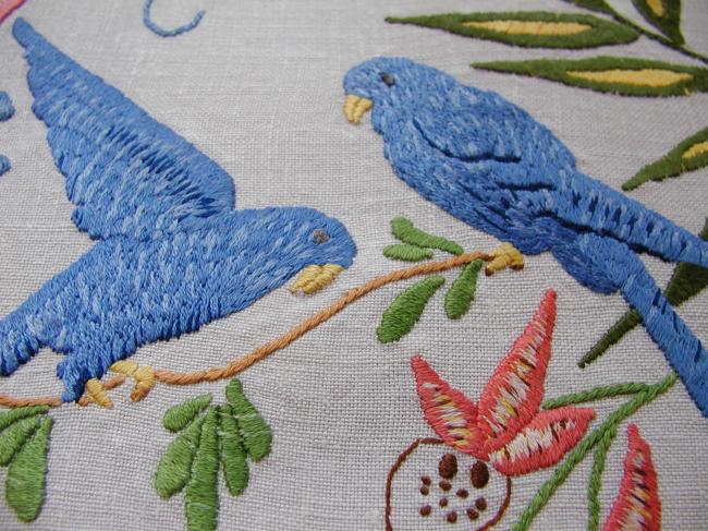 Lovely linen doily with hand-embroidered exotic birds