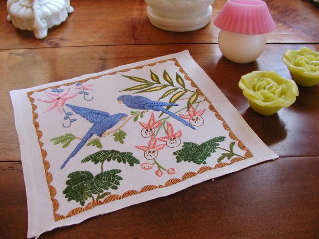 Lovely linen doily with hand-embroidered exotic birds