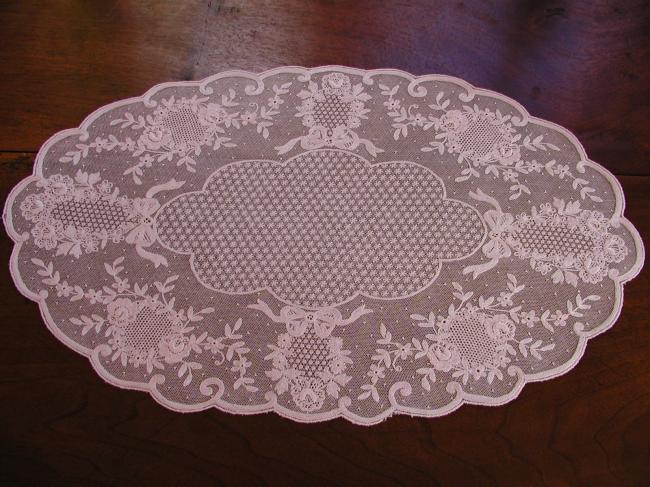 Beautiful oval pink  able centre made of embroidered net
