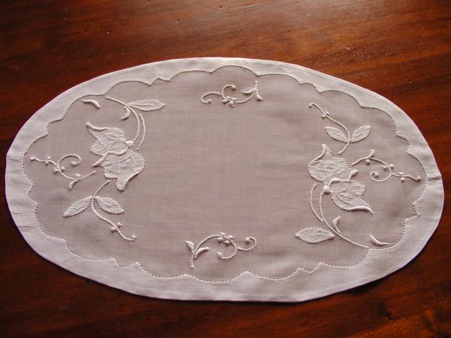 Lovely oval doily in organdi with appliqués