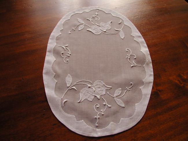 Lovely oval doily in organdi with appliqués