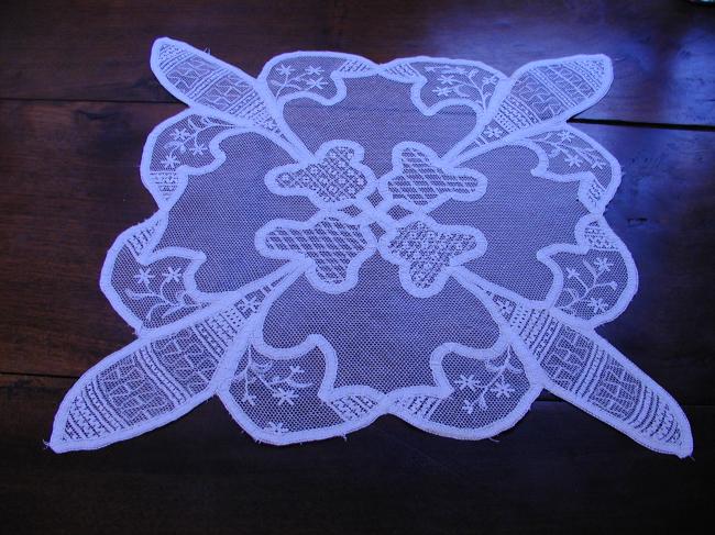 Wonderful doily with net embroidery and tape lace works