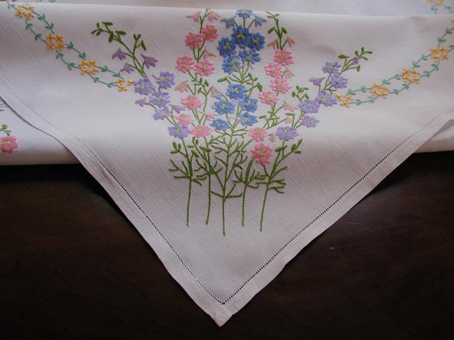 Breathtaking tablecloth with hand embroidered lavish delphinium flowers