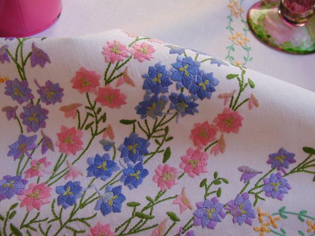 Breathtaking tablecloth with hand embroidered lavish delphinium flowers