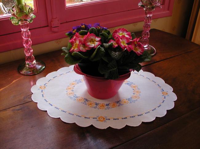 Very sweet oval table centre with orange and blue embroidered flowers