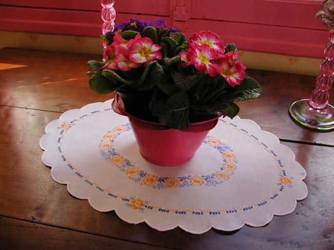Very sweet oval table centre with orange and blue embroidered flowers
