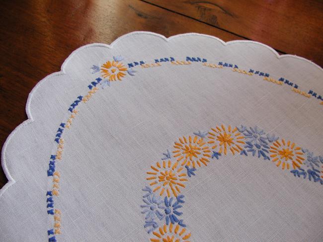 Very sweet oval table centre with orange and blue embroidered flowers